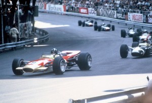 Graham Hill leads the 1968 Monaco Grand Prix in the Gold Leaf Lotus 49 (Chassis R5)